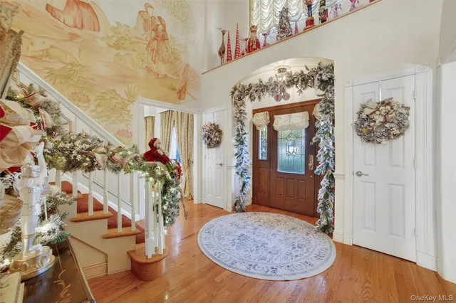 a view of a dining room with furniture and chandelier
