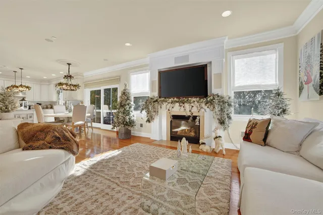 a living room with fireplace furniture and a flat screen tv