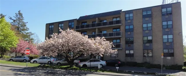 a front view of a building with garden