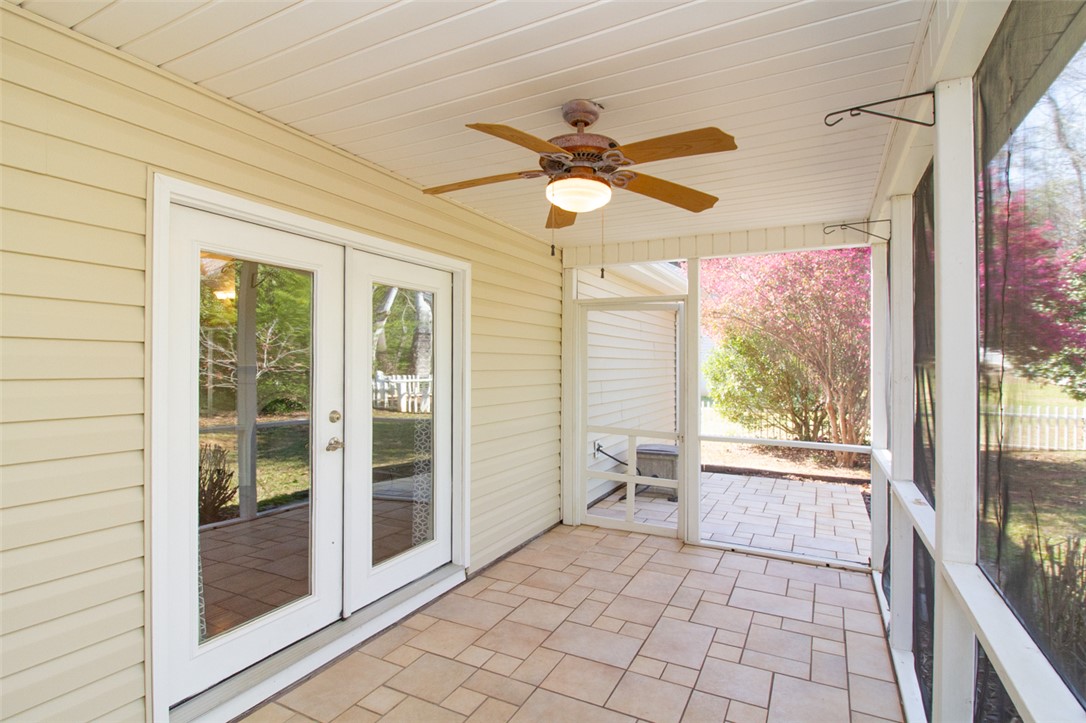 735 Britton Street Anderson, SC 29621 - Photo 14 of 50 This inviting patio features durable tile flooring, creating a perfect space for outdoor enjoyment.