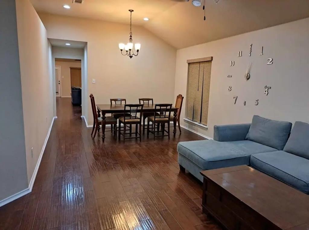 5326 Creek Court Garland, TX 75043 - Photo 6 of 6 a living room with furniture wooden floor and dining table
