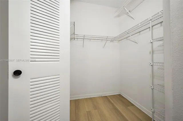 a bathroom with a window and a shower