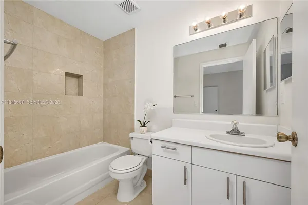 a bathroom with a sink a toilet and a bathtub