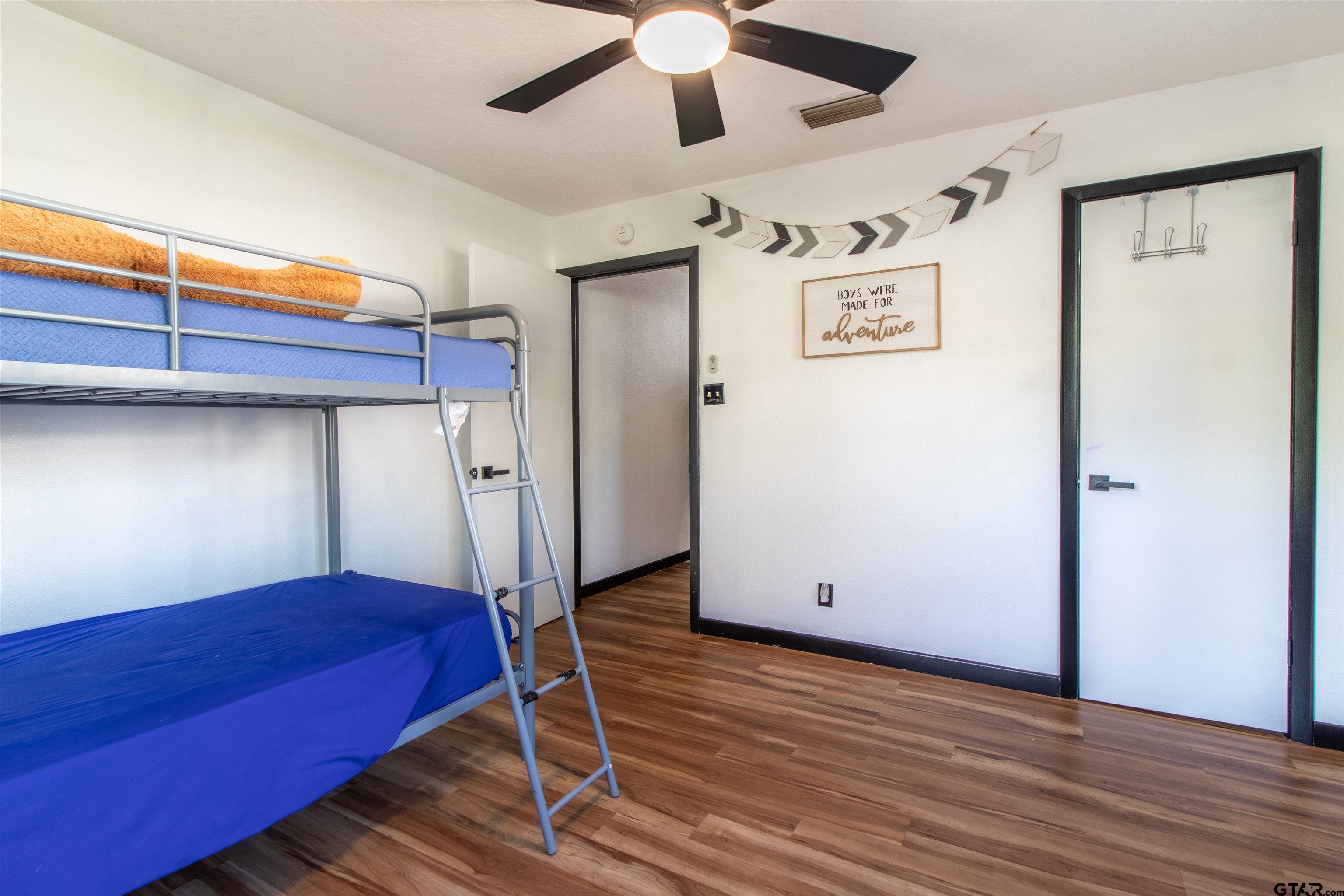 513 Lance Road Quitman, TX 75783 - Photo 12 of 27 a view of a hallway with wooden floor