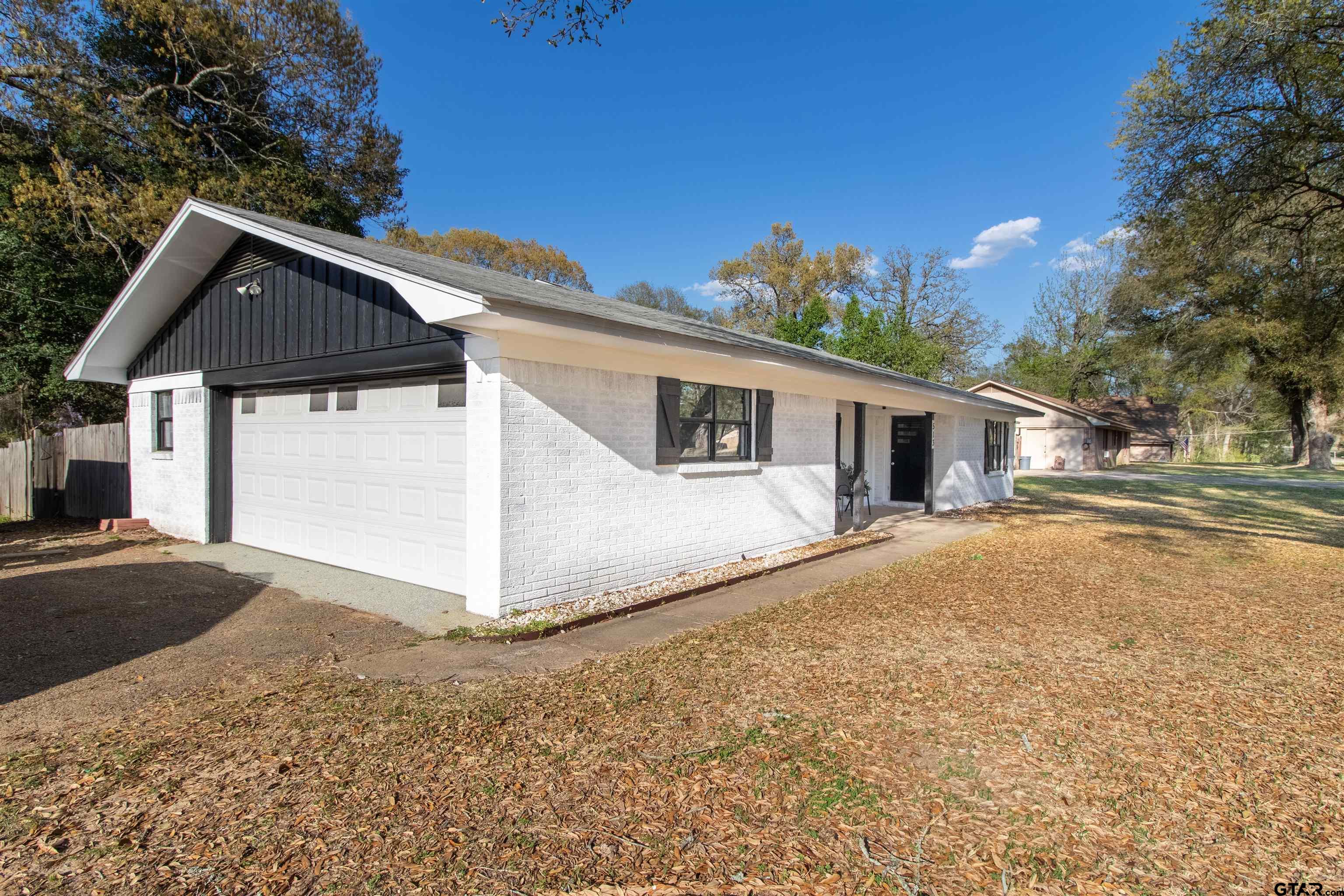 513 Lance Road Quitman, TX 75783 - Photo 22 of 27 a view of a house with a yard