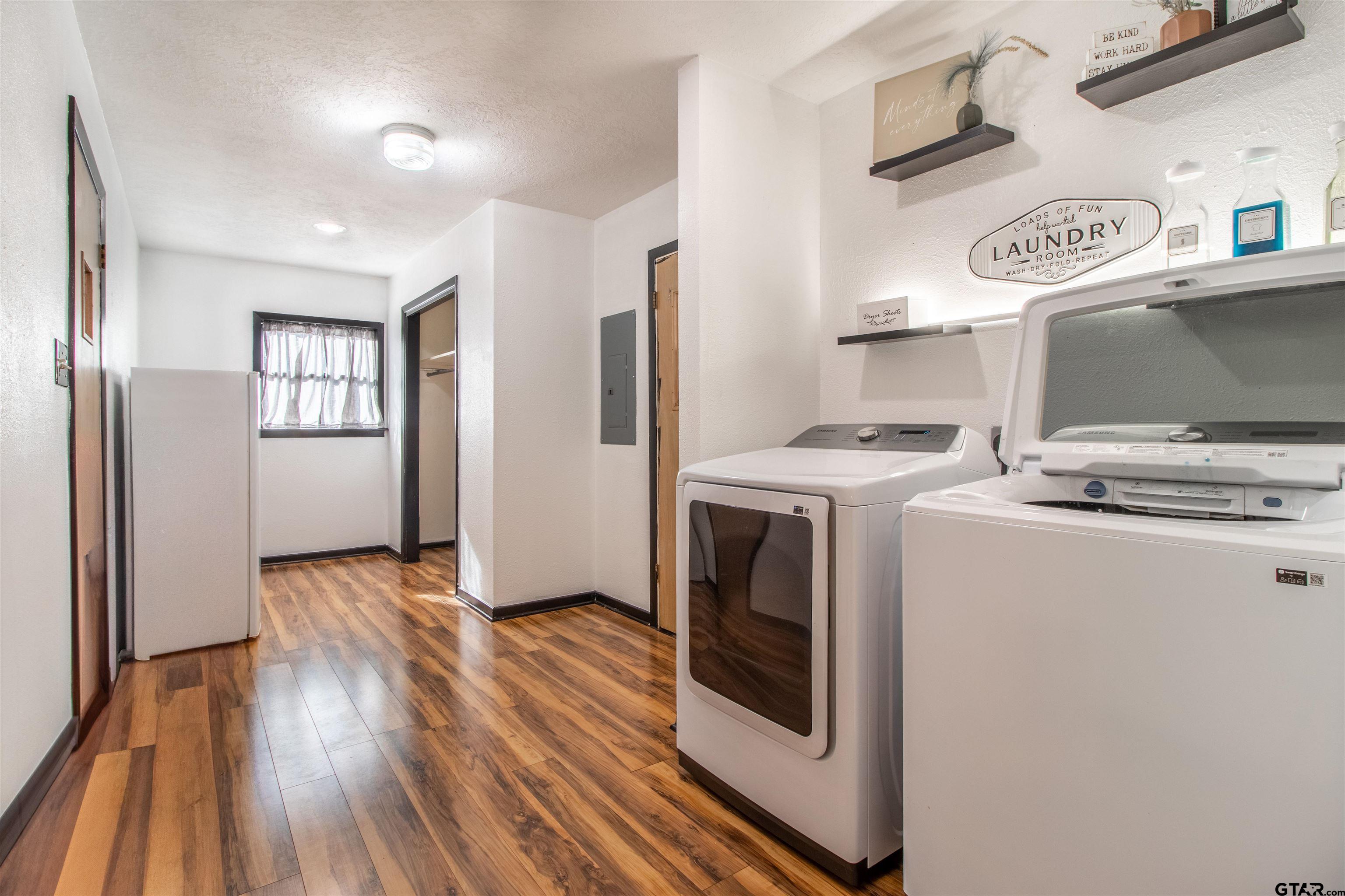 513 Lance Road Quitman, TX 75783 - Photo 10 of 27 a kitchen with stainless steel appliances granite countertop a stove and a refrigerator