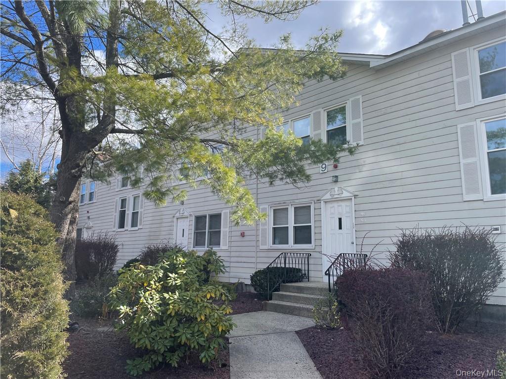 135 West Nyack Road, Unit 93 Nanuet, NY 10954 - Photo 2 of 12 a view of a house with a yard and potted plants