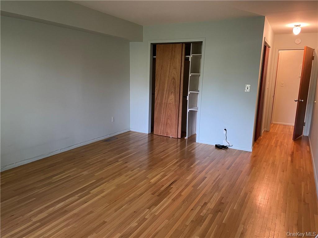 135 West Nyack Road, Unit 93 Nanuet, NY 10954 - Photo 7 of 12 a view of a room with wooden floor and a staircase