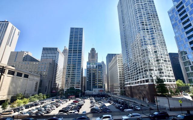 a kitchen with a sink a stove and white cabinets