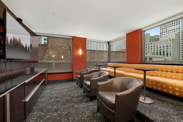 a view of a dining room with furniture and window