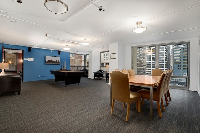 a workspace with furniture hardwood and a window