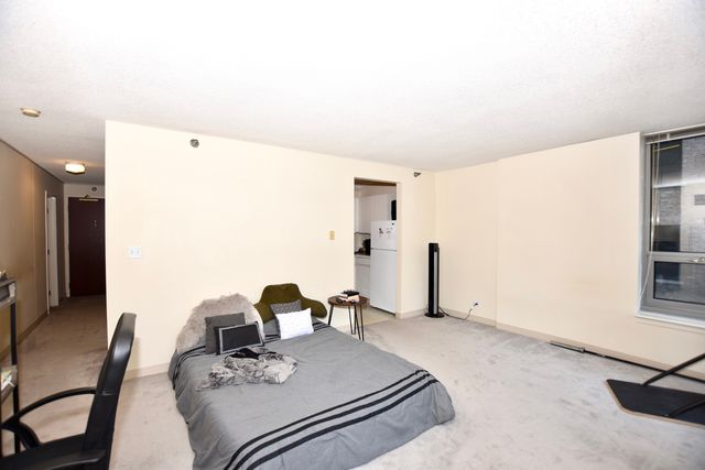 a front view of a building with a yard