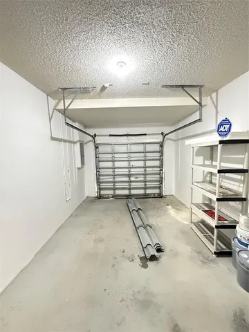 a view of a lake with a garden and plants