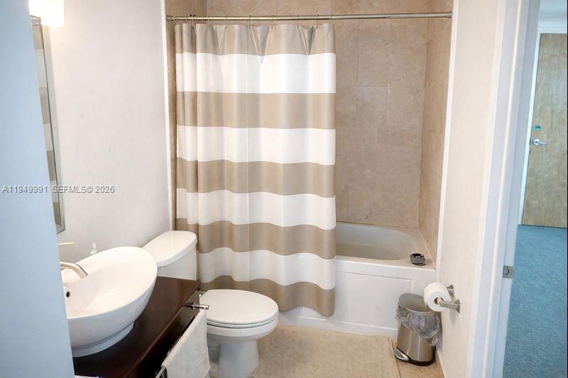 350 South Miami Avenue, Unit 2215 Miami, FL 33130 - Photo 6 of 20 a white toilet sitting next to a bathroom sink