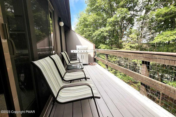 a view of balcony with furniture