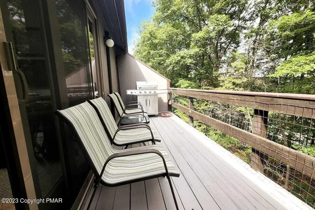 a view of balcony with furniture