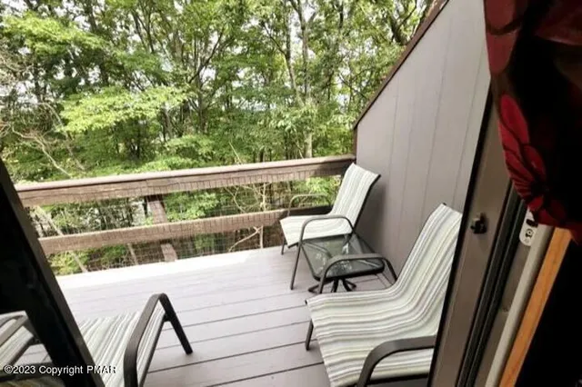 a view of balcony with furniture