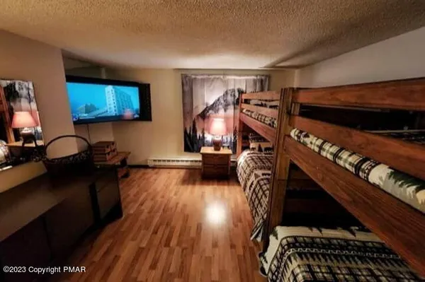 a view of a livingroom with furniture and a flat screen tv