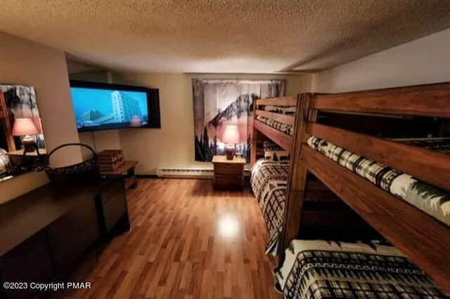 a view of a livingroom with furniture and a flat screen tv