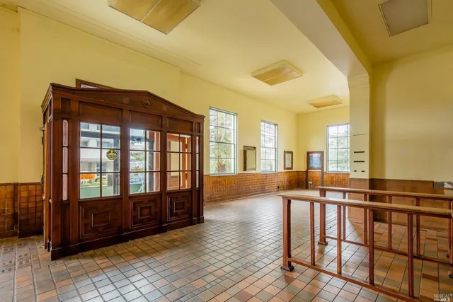 a view of spacious bedroom with furniture and balcony