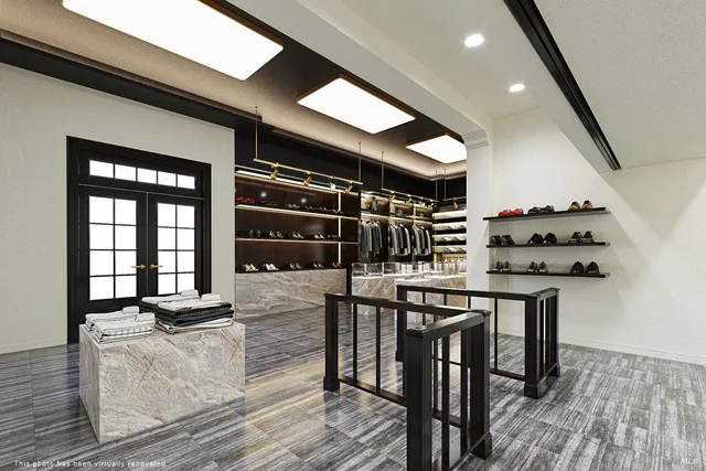 a view of a room with wooden floor and windows