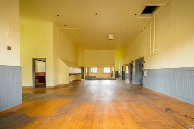 a view of a building from a floor to ceiling window