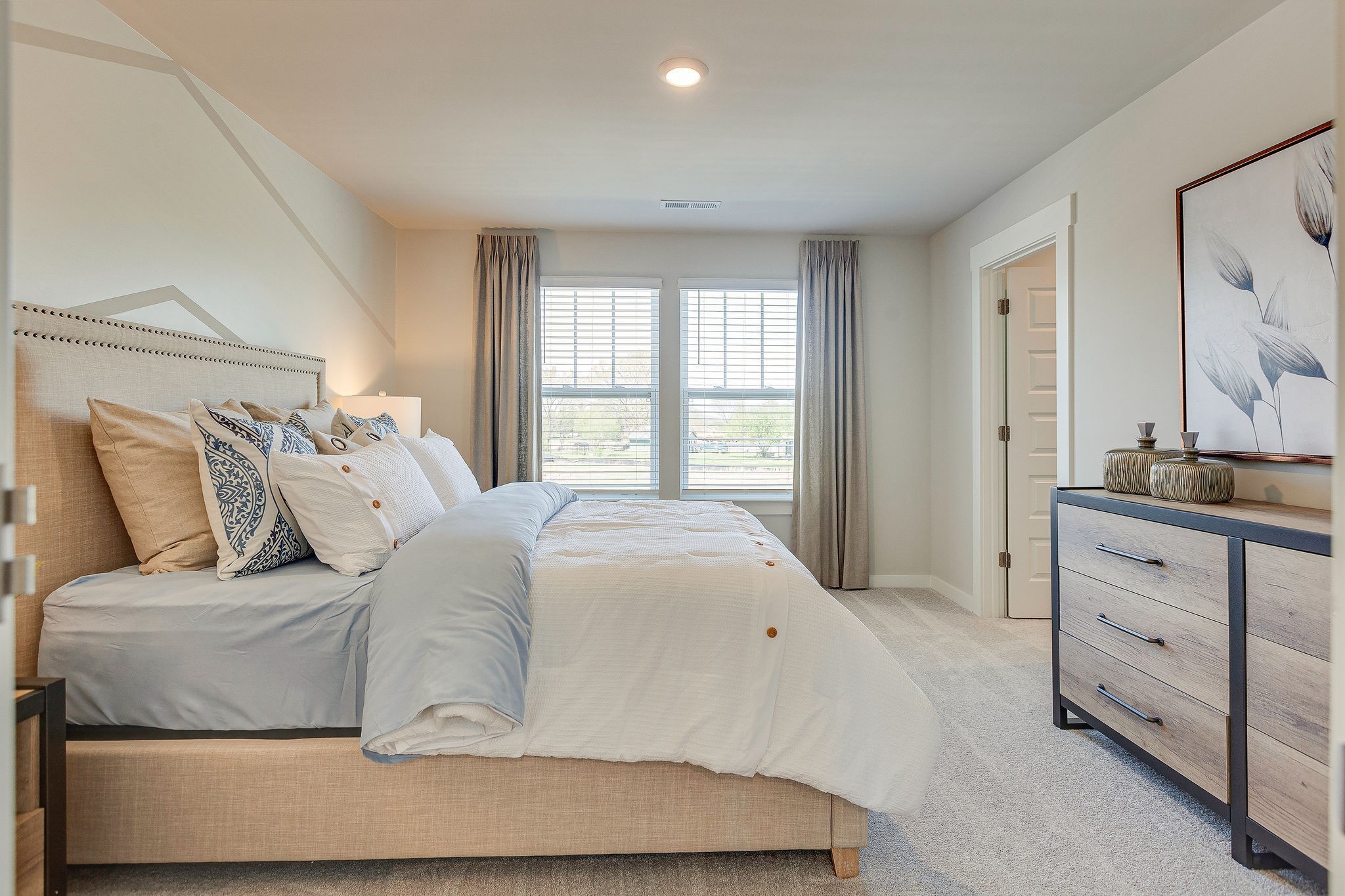 2428 Williams Ridge Drive Columbia, TN 38401 - Photo 17 of 30 a bedroom with a large bed and a dresser