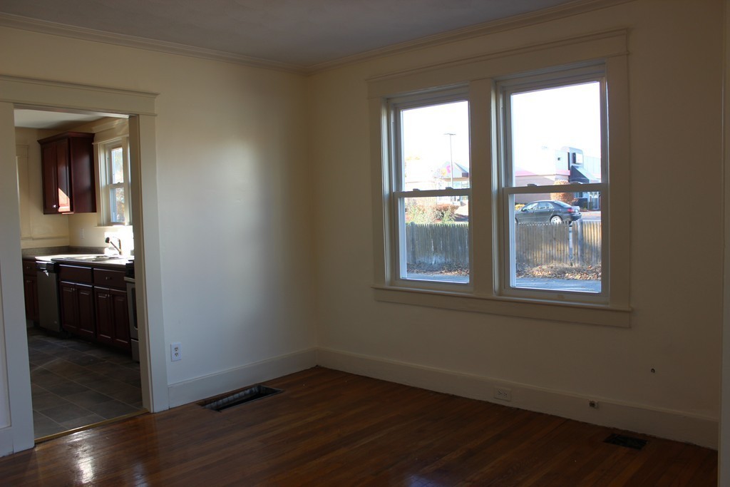463 Boston Road Billerica, MA 01821 - Photo 14 of 19 a view of an empty room with wooden floor and a window