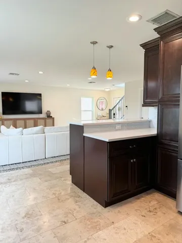 a kitchen with a sink and a stove
