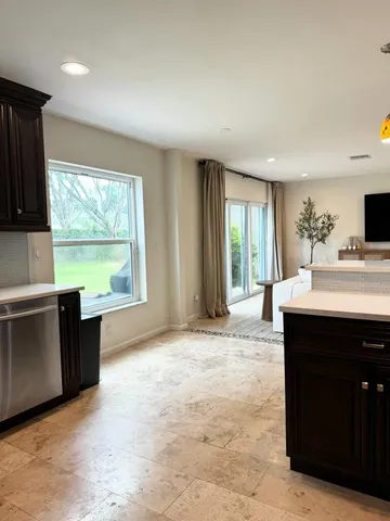 a kitchen with a sink and a window
