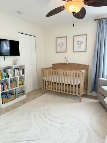 a bed room with a bed and a flat screen tv