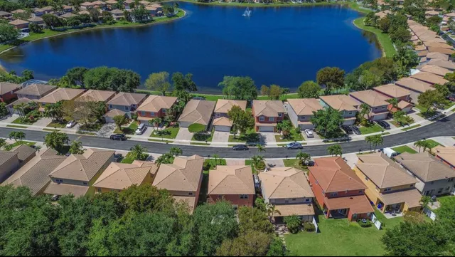 an aerial view of a house with a lake view
