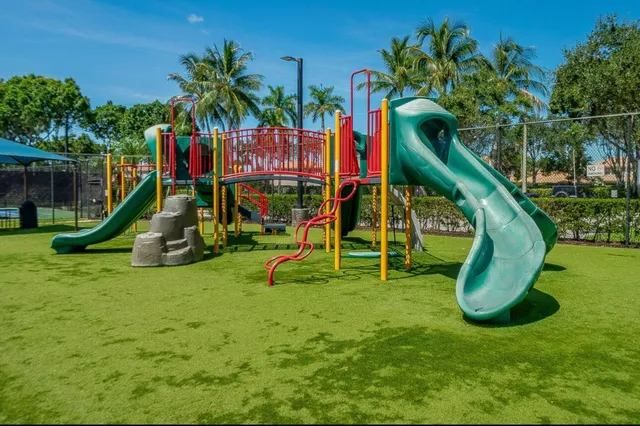 a view of a park with a slide