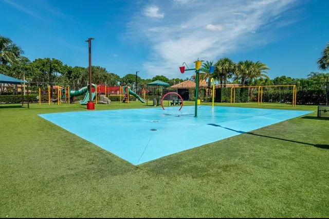 a front view of a multi story building with a sign board