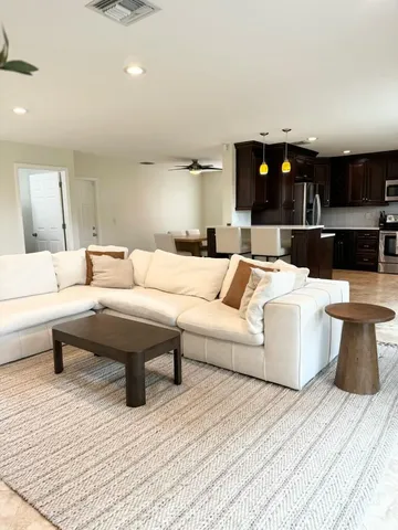 a living room with furniture and a couch
