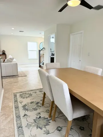 a living room with a couch and a rug