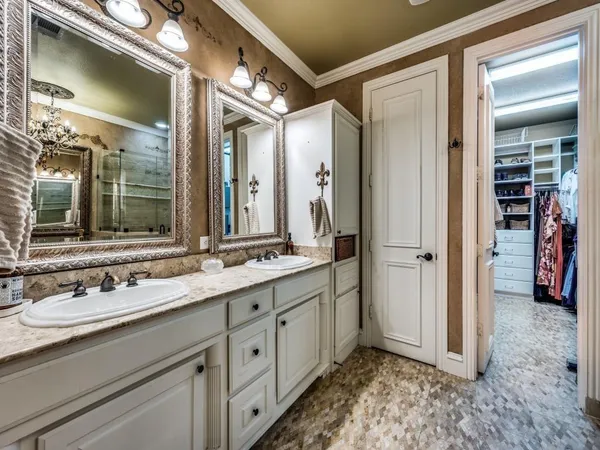 a bathroom with a double vanity sink and a mirror