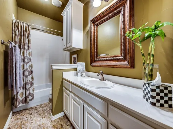 a bathroom with a double vanity sink and a mirror