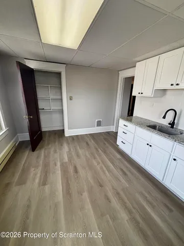 a view of a kitchen with cabinets