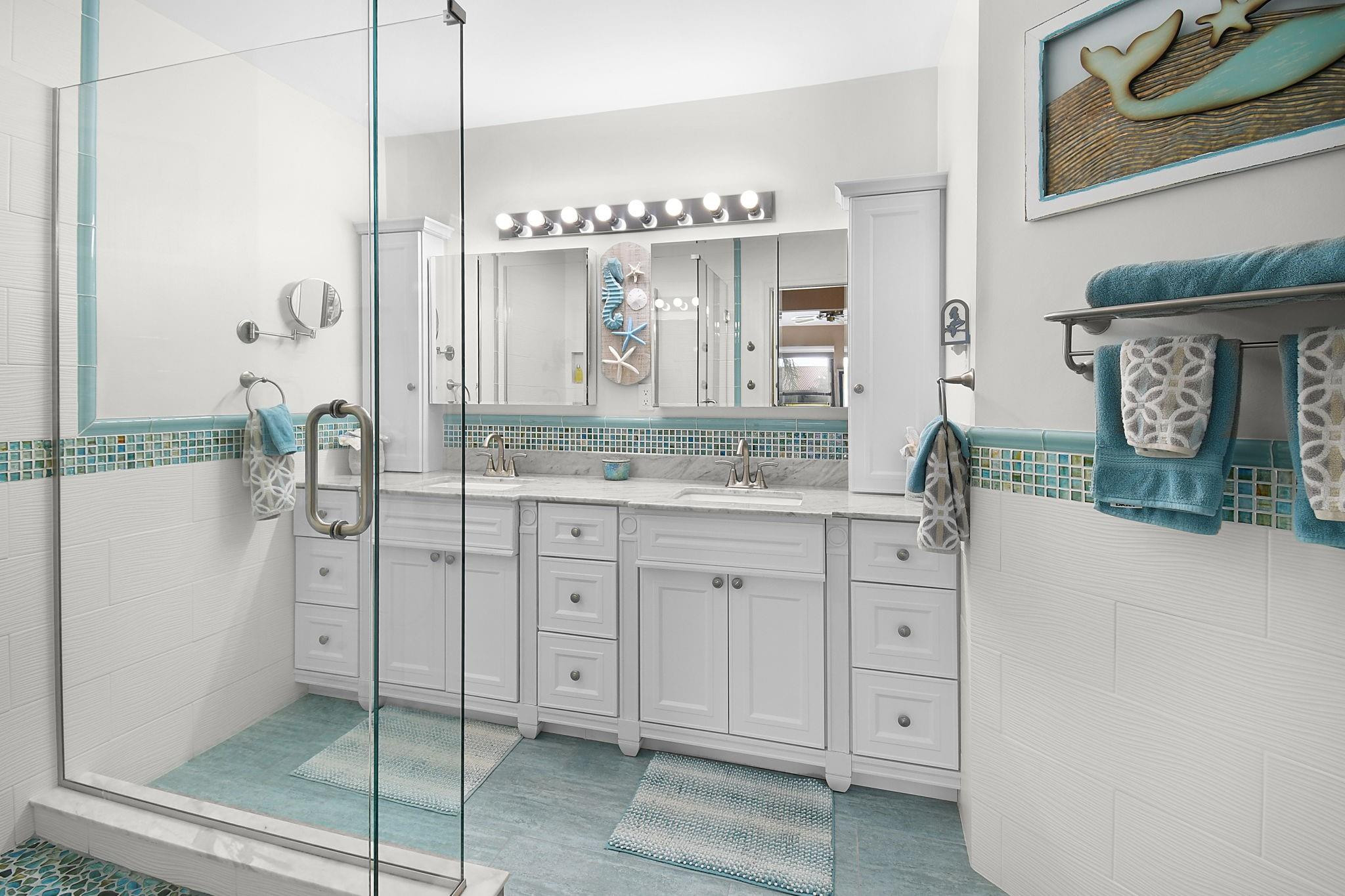 6040 Southeast Martinique Drive, Unit 201 Stuart, FL 34997 - Photo 28 of 63 LUXURIOUS PRIMARY BATHROOM