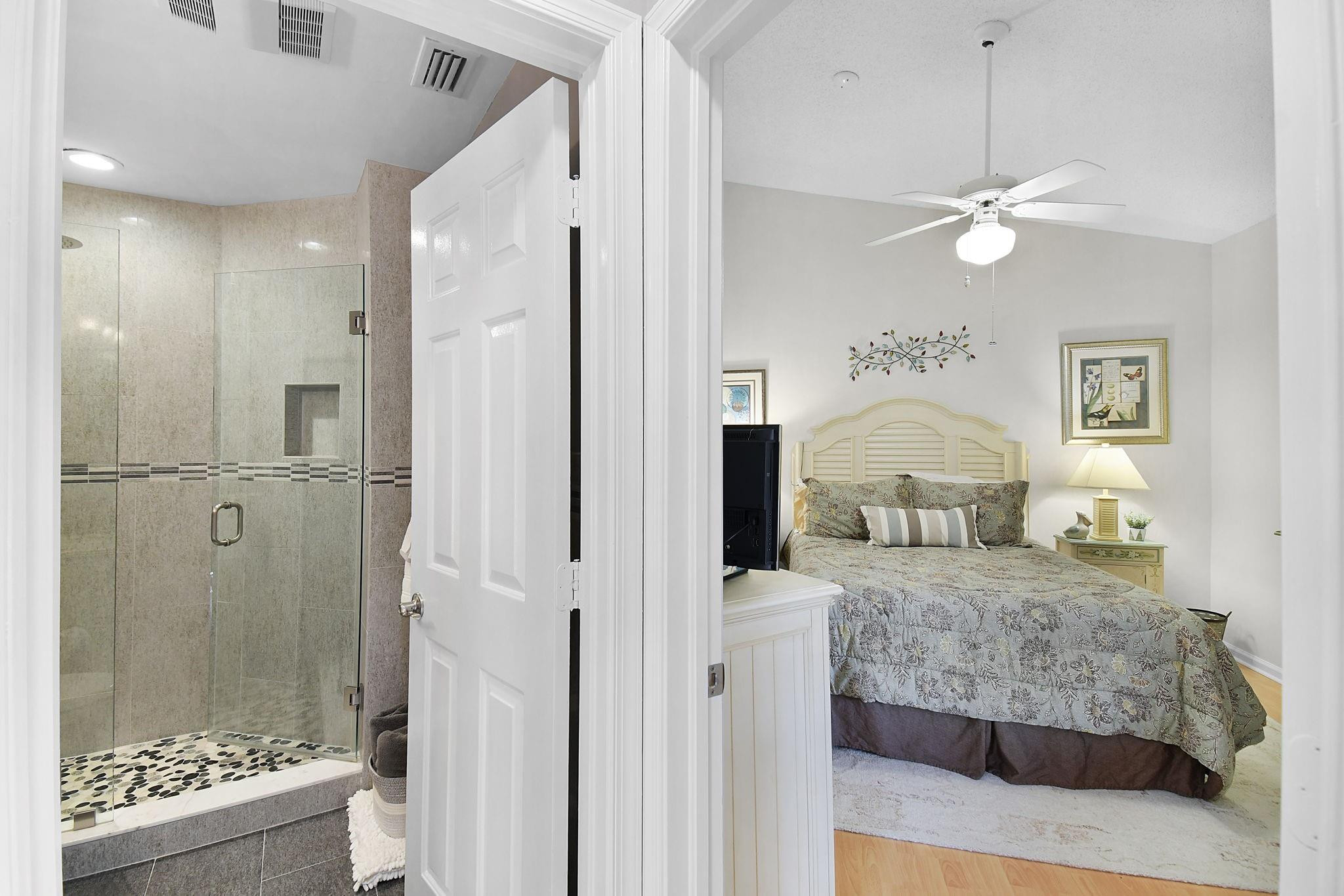 6040 Southeast Martinique Drive, Unit 201 Stuart, FL 34997 - Photo 31 of 63 ENTRANCE TO GUEST BEDROOM AND BATHROOM