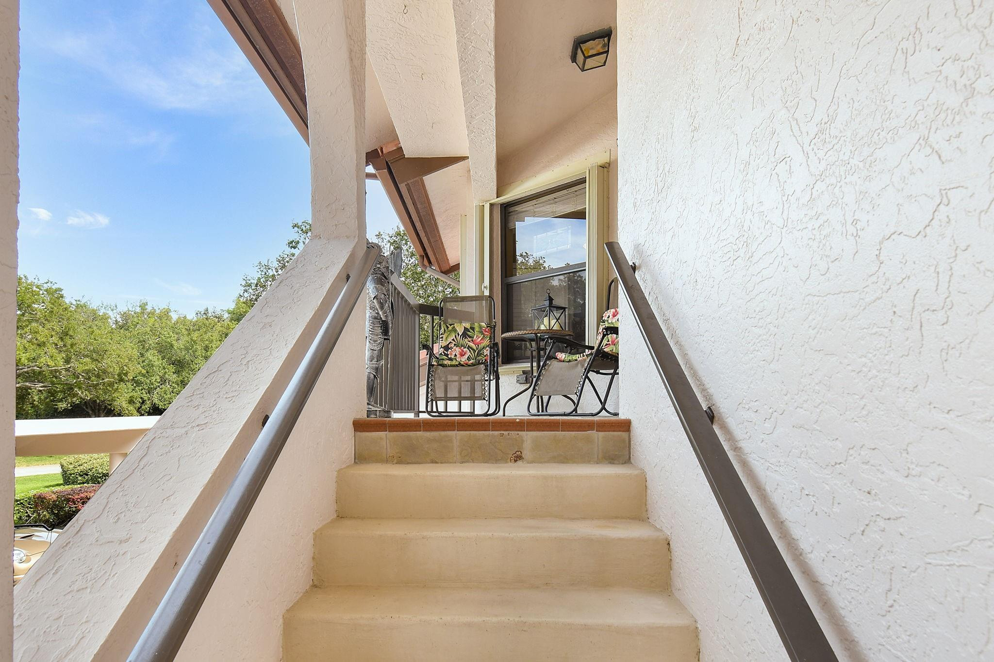 6040 Southeast Martinique Drive, Unit 201 Stuart, FL 34997 - Photo 34 of 63 PRIVATE STAIRS TO CONDO