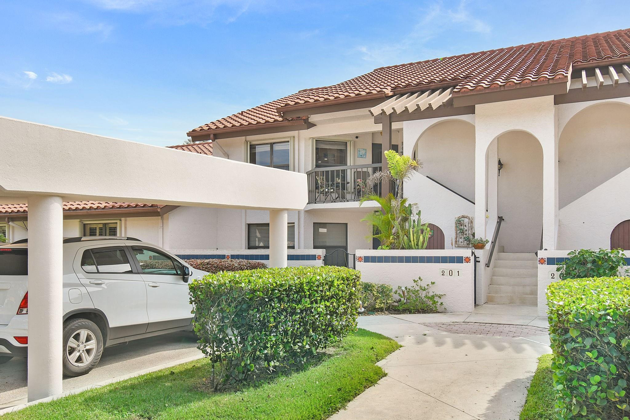 6040 Southeast Martinique Drive, Unit 201 Stuart, FL 34997 - Photo 39 of 63 PARKING AT THE FOOT OF THE STEPS