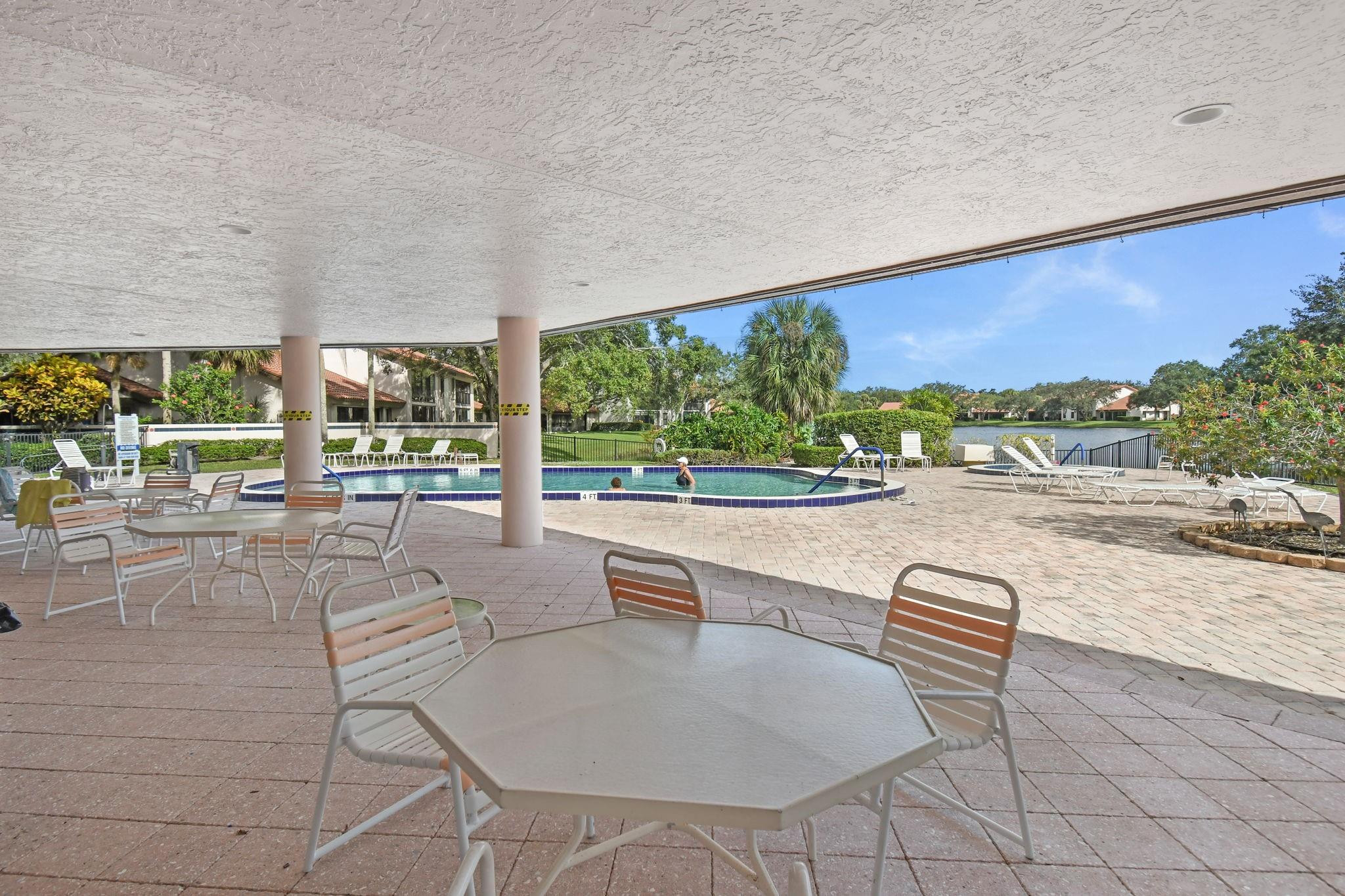 6040 Southeast Martinique Drive, Unit 201 Stuart, FL 34997 - Photo 44 of 63 CLUBHOUSE POOL AREA