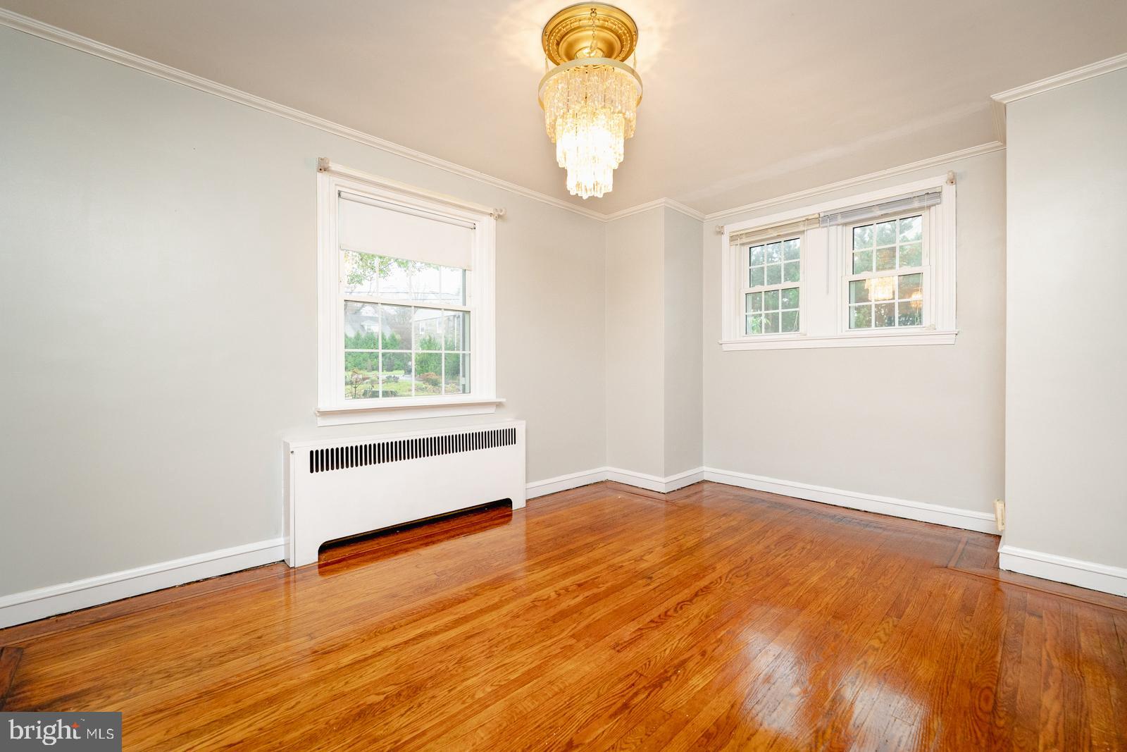 637 Croyden Road Cheltenham, PA 19012 - Photo 16 of 48 wooden floor in an empty room with a window