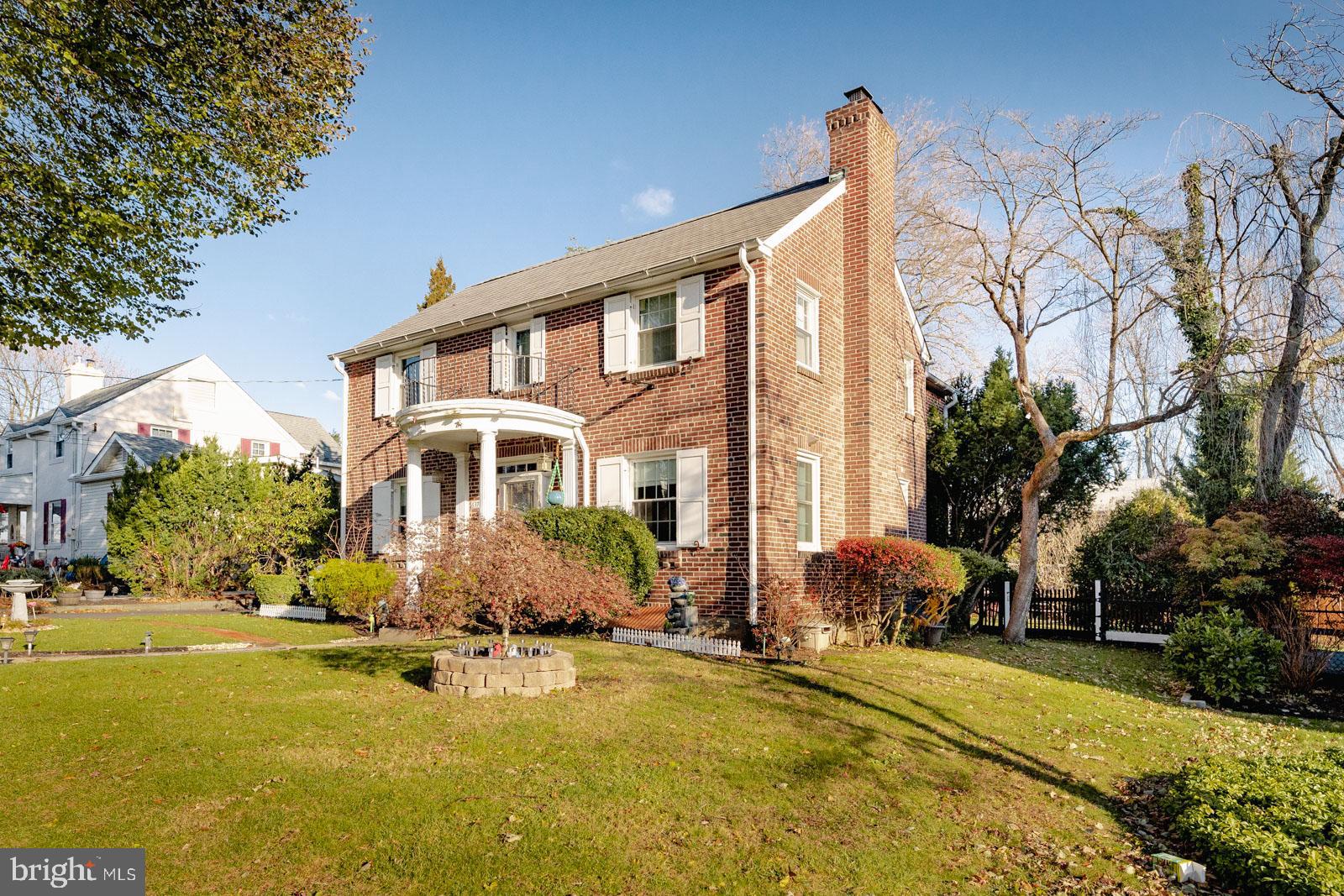 637 Croyden Road Cheltenham, PA 19012 - Photo 2 of 48 a front view of house with yard and trees in the background