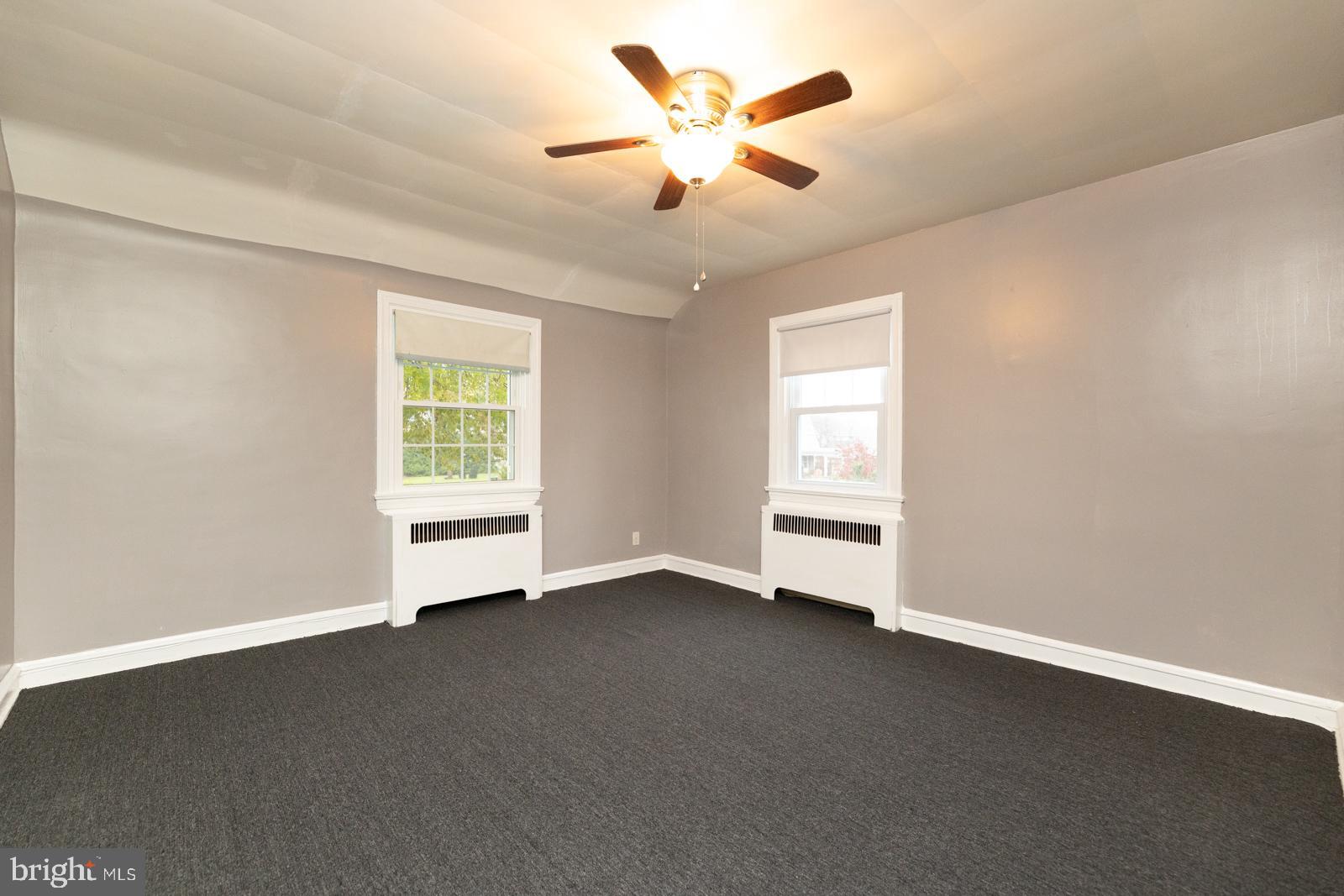 637 Croyden Road Cheltenham, PA 19012 - Photo 23 of 48 an empty room with a window and a ceiling fan