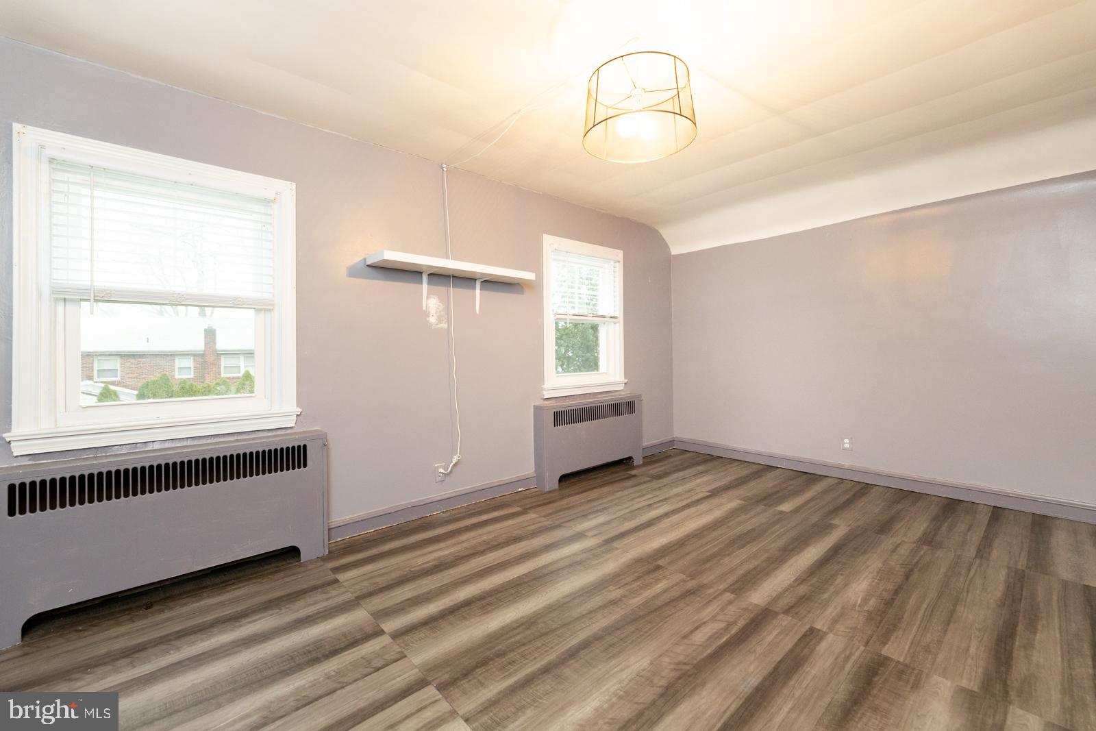 637 Croyden Road Cheltenham, PA 19012 - Photo 26 of 48 wooden floor in an empty room with a window