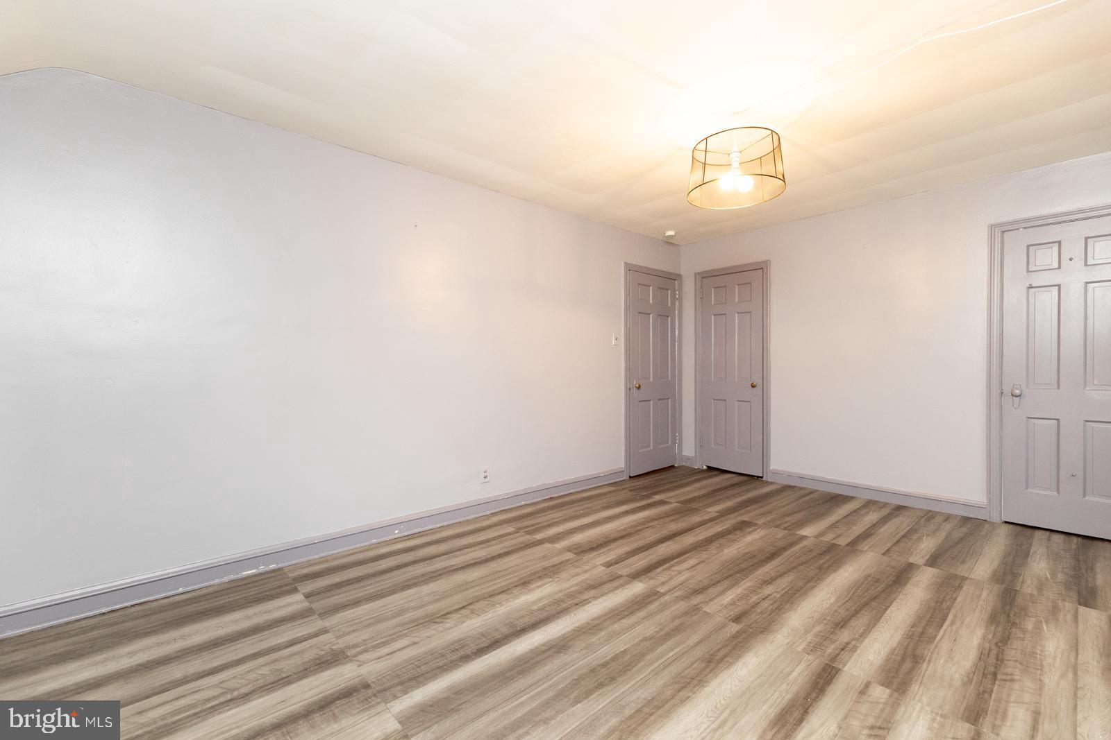637 Croyden Road Cheltenham, PA 19012 - Photo 28 of 48 a view of an empty room with wooden floor and windows