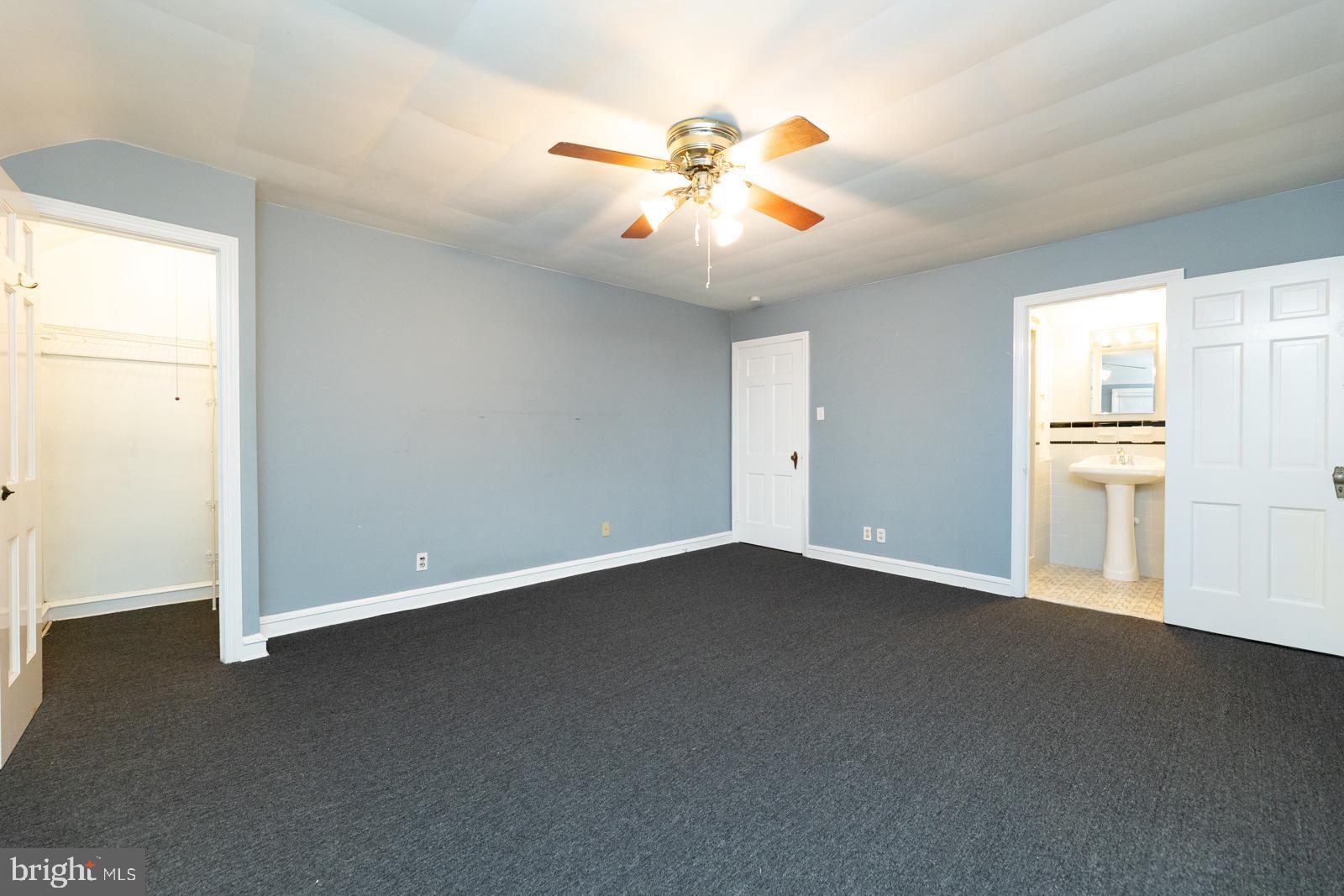 637 Croyden Road Cheltenham, PA 19012 - Photo 32 of 48 an empty room with windows and ceiling fan